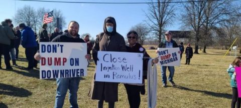 Joining a protest with around 50 people near her home, Jacqueline crafted signs that read, "Don't dump waste where people live!" on one side and "Remove the toxic well from Michigan!" on the other.
