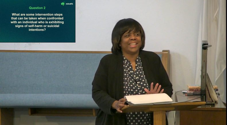Patricia Andrews-Pierre, a licensed clinical social worker, speaks to a MindFit audience.
