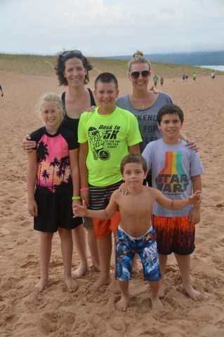 Tonya, Heidi and the kiddos pose on their dune climb adventure.